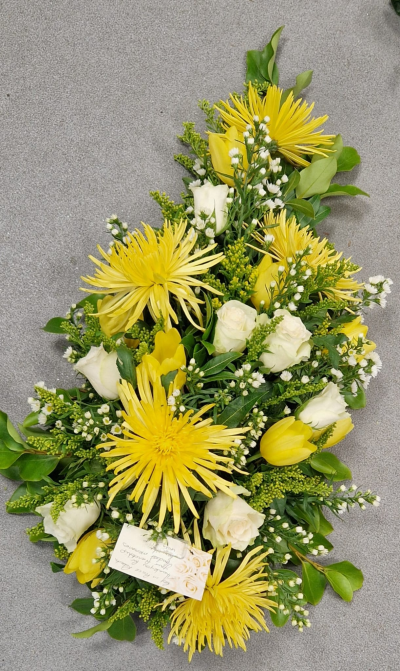 Ray of Sunshine - A bright yellow and white funeral tribute, thoughtfully arranged to create a warm and meaningful farewell.