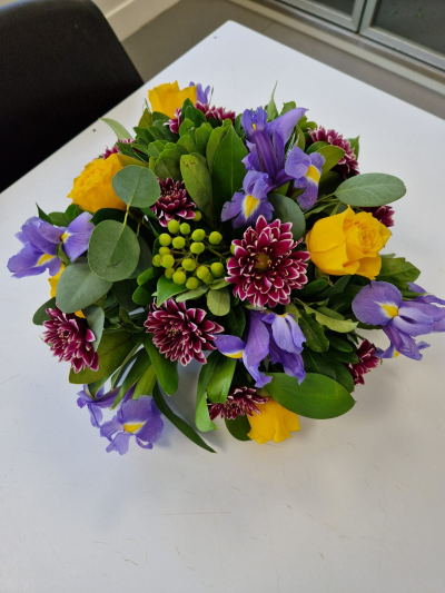 Golden Violet - A vibrant arrangement combining rich purple and sunny yellow tones for a cheerful, colourful gift.