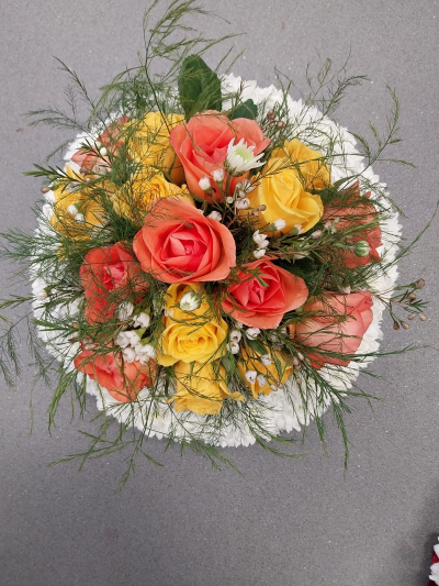 Sunset Glow - A warm and uplifting arrangement in beautiful yellow, peach and white shades.