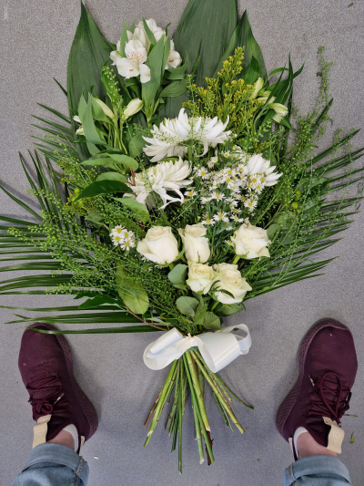 Peaceful Farewell - An elegant tied funeral sheaf in soft white and green tones, beautifully finished for a graceful tribute.