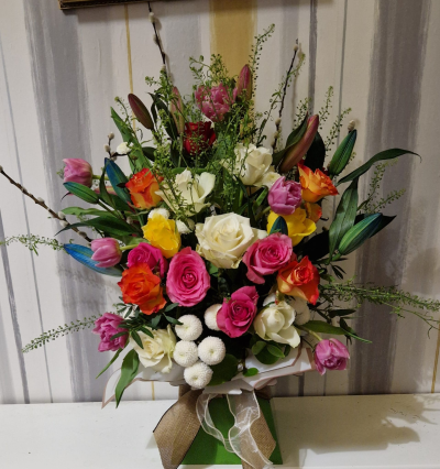 Celebration of Colour - A beautiful statement arrangement bursting with bright, uplifting colours, perfect for making a memorable impression.