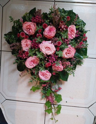 Forever in My Heart - A beautiful heart-shaped funeral tribute in soft pink and rich green tones, lovingly created to remember someone special.